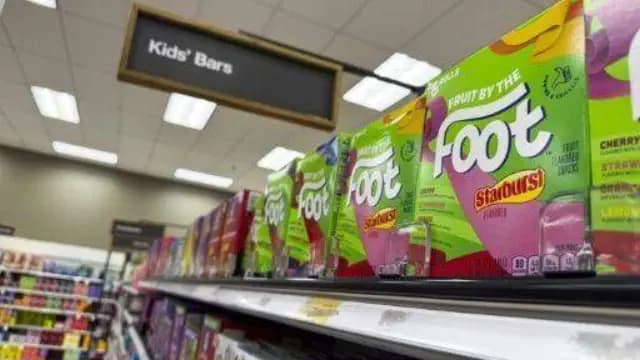 In this illustrated photograph taken on December 27, 2024, a supermarket shelf displays Fruit by the Foot, a snack that contains Red Dye No 3.
